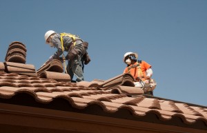 men fixing roof