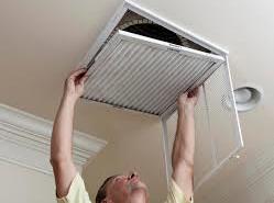 man opening Air Conditioner