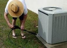 man cleaning Air Conditioning